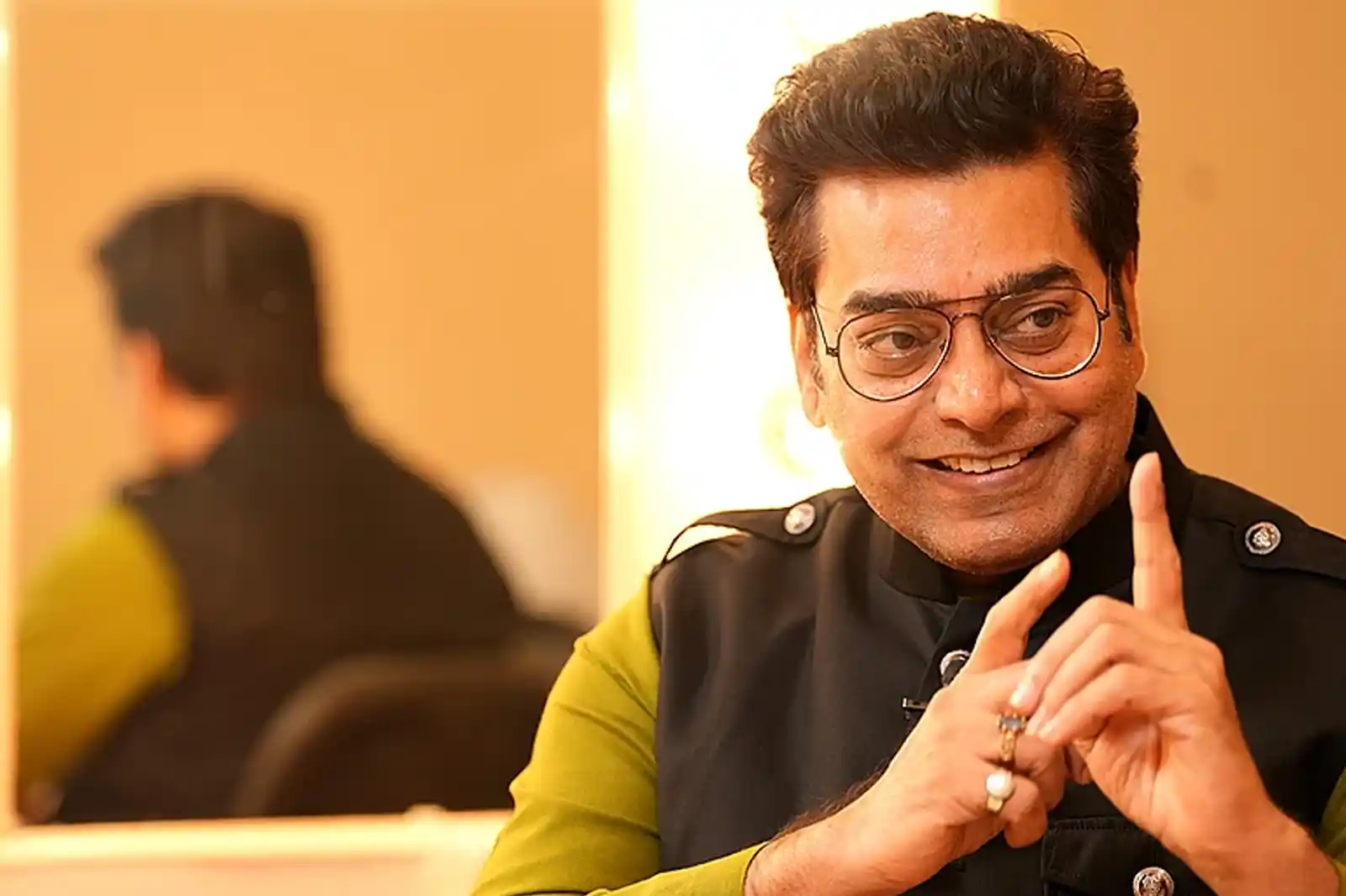 Ashutosh Rana with a menacing, calculating smirk.
