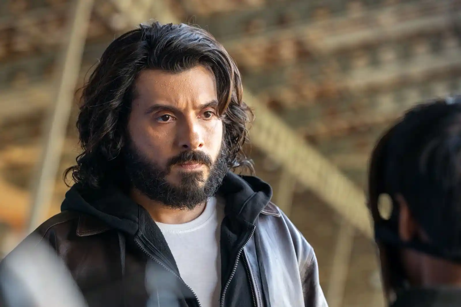 Divyenndu with a rugged, intense expression